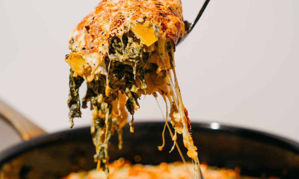 This Healthy-ish Artichoke Dip Keeps All The Creaminess, Just With More Veggies